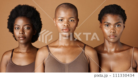 Skincare, face or African models with beauty, glowing skin or afro isolated on brown background. Facial dermatology, black women or natural cosmetics for makeup in studio with girl friends or people Skincare, face or African models with beauty, glowing skin or afro isolated on brown background. Facial dermatology, black women or natural cosmetics for makeup in studio with girl friends or people 111330434