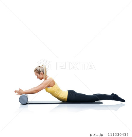 Pilates, foam roller and woman in a studio for workout, stretching or gym routine with yoga mat. Stability, balance and young female athlete from Australia with body exercise by white background. Pilates, foam roller and woman in a studio for workout, stretching or gym routine with yoga mat. Stability, balance and young female athlete from Australia with body exercise by white background. 111330455