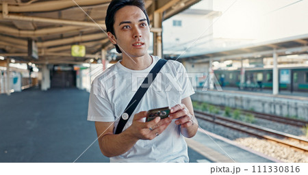Man, check phone and waiting at train station with reading, thinking and location with digital schedule. Man, travel and smartphone for transportation app, time management or map for tourism in Japan Man, check phone and waiting at train station with reading, thinking and location with digital schedule. Man, travel and smartphone for transportation app, time management or map for tourism in Japan 111330816