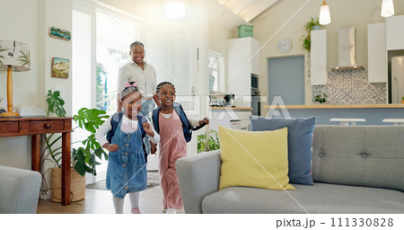 Father, family hug and student after school with love and support in a home feeling happy. House, living room and dad with children and youth with smile and young kids with papa and parent care 111330828