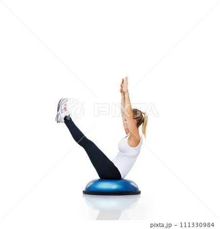 Athlete, ball or body exercise in workout for abs or core strength isolated on white background. Woman stretching, training equipment or fitness for studio mockup space, balance challenge or wellness Athlete, ball or body exercise in workout for abs or core strength isolated on white background. Woman stretching, training equipment or fitness for studio mockup space, balance challenge or wellness 111330984