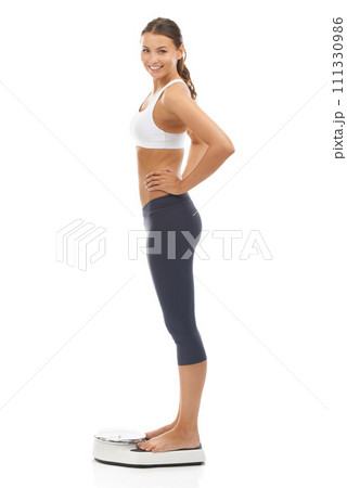 Woman, portrait and scale smile for lose weight goal target for diet achievement, mockup or white background. Female person face and happy in studio for healthy self care progress, pride or wellness Woman, portrait and scale smile for lose weight goal target for diet achievement, mockup or white background. Female person face and happy in studio for healthy self care progress, pride or wellness 111330986