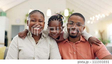 Black family, face and happy with parents and kid at home, love and bonding with hug and spending time together. Man, woman and girl child, happiness and portrait and people smile in living room 111331031