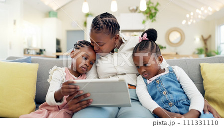 Happy, mother with her child and tablet on sofa in living room of their home together. Technology or connectivity, happiness or kissing and black family on couch streaming a movie in their house Happy, mother with her child and tablet on sofa in living room of their home together. Technology or connectivity, happiness or kissing and black family on couch streaming a movie in their house 111331110