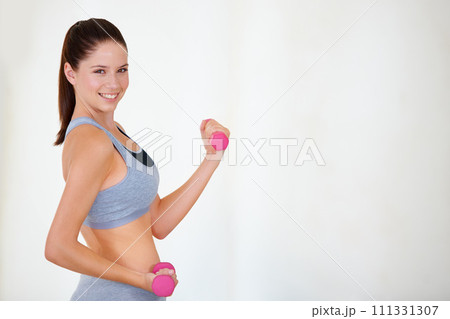 Woman, flex or portrait with dumbbells in studio, health wellness or fitness action for weight loss with exercise. Young person, pride and face with hand weights for tone muscle by white background 111331307