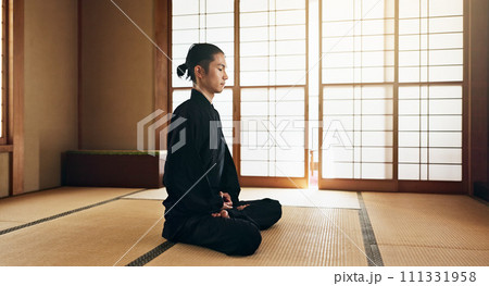 Martial arts man, meditation and exercise in Japanese dojo with mindfulness, zen or chakra balance in morning. Fighter, mma or karate person with peace, breathing and calm for yoga, wellness or floor 111331958