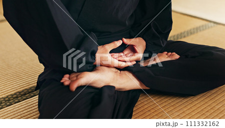 Martial arts person, meditation and floor with hands, feet and peace in dojo with spiritual guide for fight. Yoga, chakra balance and zen exercise for peace, calm or breathe for mma, karate or health Martial arts person, meditation and floor with hands, feet and peace in dojo with spiritual guide for fight. Yoga, chakra balance and zen exercise for peace, calm or breathe for mma, karate or health 111332162