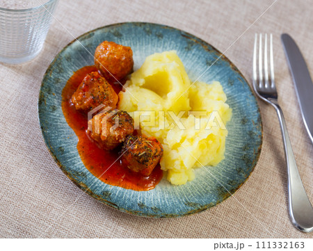 Meatballs in sauce served with mashed potatoes Meatballs in sauce served with mashed potatoes 111332163