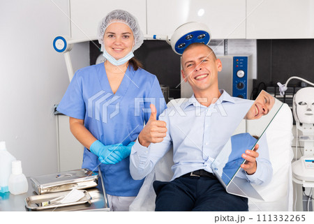 Woman doctor and male patient of clinic 111332265
