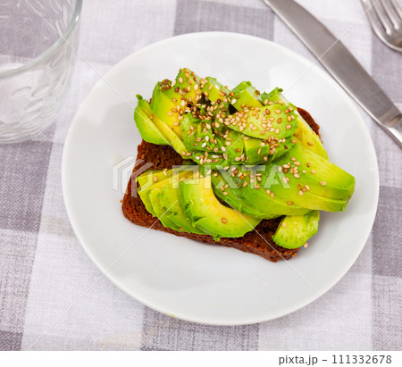 Sandwich with pieces of fresh avocado Sandwich with pieces of fresh avocado 111332678