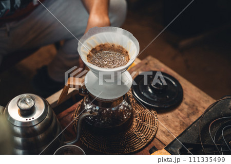 Drip coffee,coffee dripper and hands barista make coffee 111335499