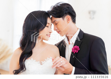 Bride and groom showcase their rings, a close-up view., symbolizing eternal love and commitment - wedding ceremony concept Bride and groom showcase their rings, a close-up view., symbolizing eternal love and commitment - wedding ceremony concept 111335616