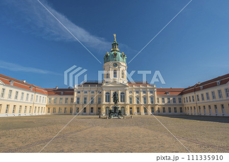 Berlin, Germany - July 19, 2022 : front side at Charlottenburg Palace (Schloss) the Baroque summer palace with garden Berlin, Germany - July 19, 2022 : front side at Charlottenburg Palace (Schloss) the Baroque summer palace with garden 111335910