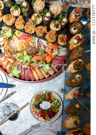 Catering Buffet with Sushi, Canapes, and Other Delicacies for Party or Event 111336777