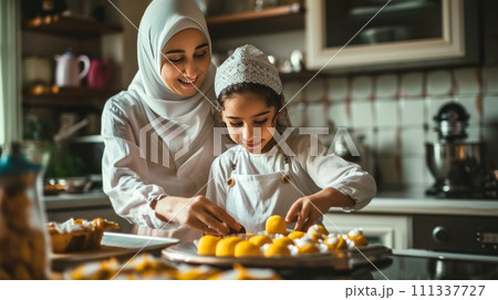 Muslim mother and daughter are cooking. Eid al-Fitr celebrations. 111337727