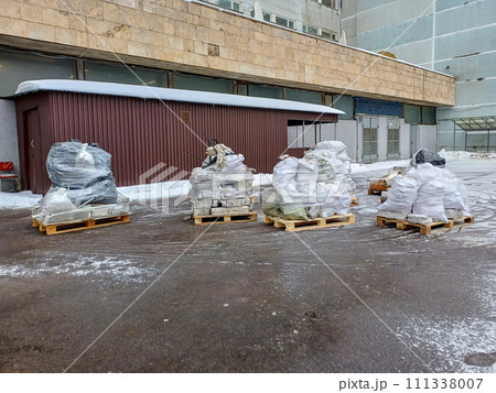 Several wooden pallets with construction waste prepared for removal 111338007