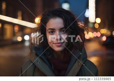 Portrait of a beautiful young woman in the city at night 111339865
