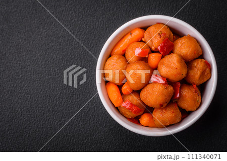 Delicious fried potato balls with vegetables, salt, spices and herbs Delicious fried potato balls with vegetables, salt, spices and herbs 111340071