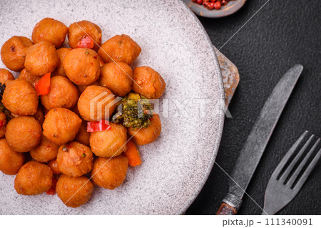 Delicious fried potato balls with vegetables, salt, spices and herbs Delicious fried potato balls with vegetables, salt, spices and herbs 111340091
