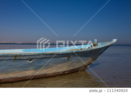 Abandoned fishing boat at sea Abandoned fishing boat at sea 111340920