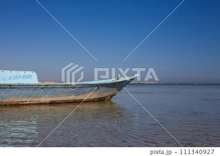Sunken fishing boat aground Sunken fishing boat aground 111340927