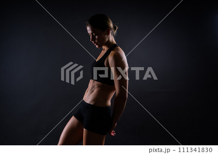 Close up of woman back with her muscles after workout. Female bodybuilder with perfect biceps 111341830