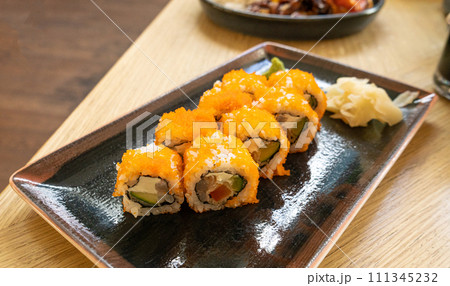 Maki Sushi, California Rolls with Cucumber, Avocado, Raw Fish and Red Tobiko Caviar, Makizushi 111345232
