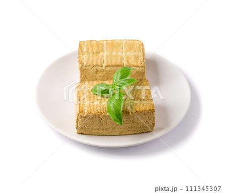 Tofu Cheese Isolated, Smoked Vegan Cheese Slice, Sliced Soya Bean Curd, Soy Protein or TSP Tofu Cheese Isolated, Smoked Vegan Cheese Slice, Sliced Soya Bean Curd, Soy Protein or TSP 111345307