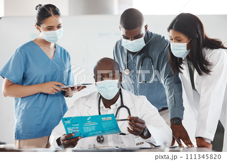 Covid doctor, hospital meeting and talking about treatment at clinic, planning consulting team and healthcare strategy on paper. Medical collaboration with tablet for development of medicine at work 111345820