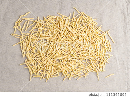 Raw Trofie Pasta, Dry Italian Macaroni, Traditional Genoa Food, Raw Noodle, Modern Ligurian Cuisine 111345895