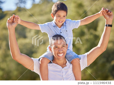 Happy dad, child and family nature walk of a kid on father shoulders with a smile in the summer sun. Happiness, fun and outdoors experience of a man and kid walking and hiking in nature together Happy dad, child and family nature walk of a kid on father shoulders with a smile in the summer sun. Happiness, fun and outdoors experience of a man and kid walking and hiking in nature together 111346438