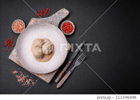 Delicious meatballs from minced chicken or turkey with sour cream sauce Delicious meatballs from minced chicken or turkey with sour cream sauce 111346896