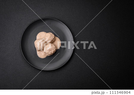 Delicious meatballs from minced chicken or turkey with sour cream sauce Delicious meatballs from minced chicken or turkey with sour cream sauce 111346904