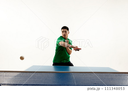 Athletic table tennis stance from competitive Asian sportsman, player in sportswear in motion against white studio background. Athletic table tennis stance from competitive Asian sportsman, player in sportswear in motion against white studio background. 111348053