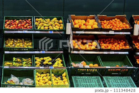 Greengrocery section at retail store in Europe. Greengrocery in local supermarket, defocused background 111348428