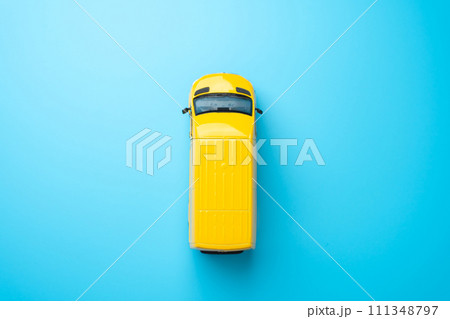 Yellow delivery van top view. Copy space. Delivery of goods and cargo within the city. Delivering goods and services. E-commerce, retail, or other industries on efficient distribution networks. 111348797