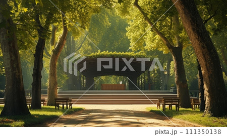 An elegant stage positioned in a tranquil park, framed by ancient trees 111350138