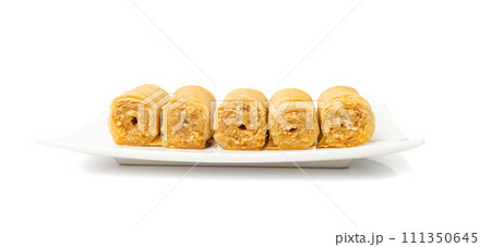 Rolled Baklava Isolated, Ramadan Dessert Roll on Restaurant Plate, Eastern Sweet Pastries 111350645