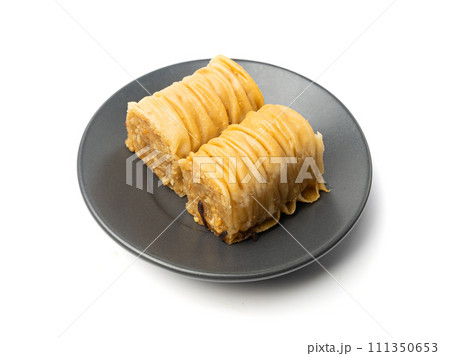 Rolled Baklava Isolated, Ramadan Dessert Roll on Restaurant Plate, Eastern Sweet Pastries 111350653