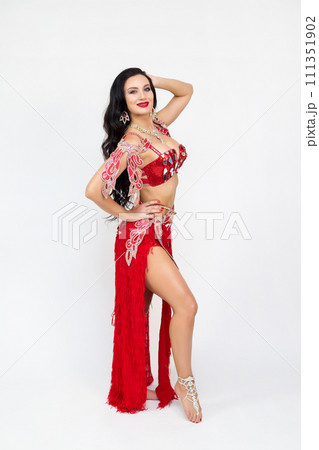 Photo of a middle-aged dancer in a red variety costume 111351902