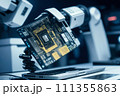 Robot arm picks up computer chip 111355863