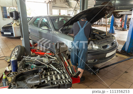 A Selective focus of mechanic's toolbox with tools in drawers, 111356253