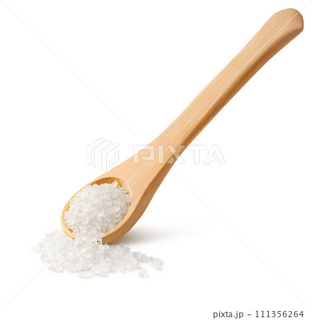 Crystals of salt in a wooden spoon with long handle isolated on white background Crystals of salt in a wooden spoon with long handle isolated on white background 111356264