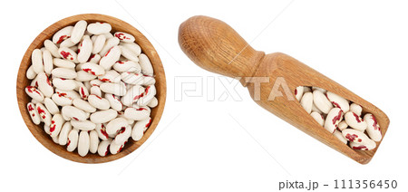 variegated kidney bean in wooden bowl and scoop isolated on white background. Top view. Flat lay 111356450