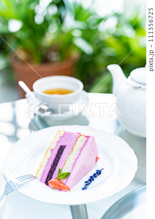 tea with lavender croissant and raspberry cheesecake for breakfast. white cup 111356725