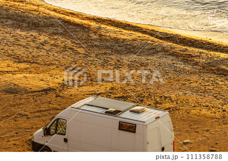 Camper van on beach in the morning 111358788