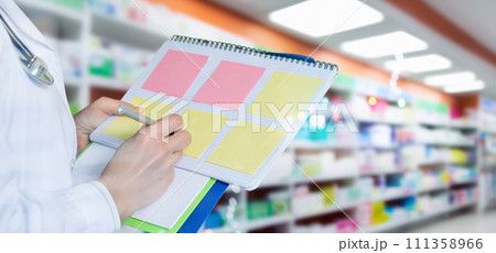 The doctor plans the procedure in his diary. The doctor plans the procedure in his diary. 111358966