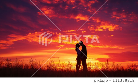 A couple's passionate kiss under a vibrant sunset, love igniting in the twilight 111359818