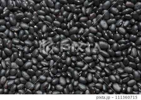 Black beans background. Texture of black bean grains, top view. Black beans background. Texture of black bean grains, top view. 111360715