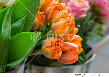 Orange tulips in the vase. Orange tulips in the vase. 111361062